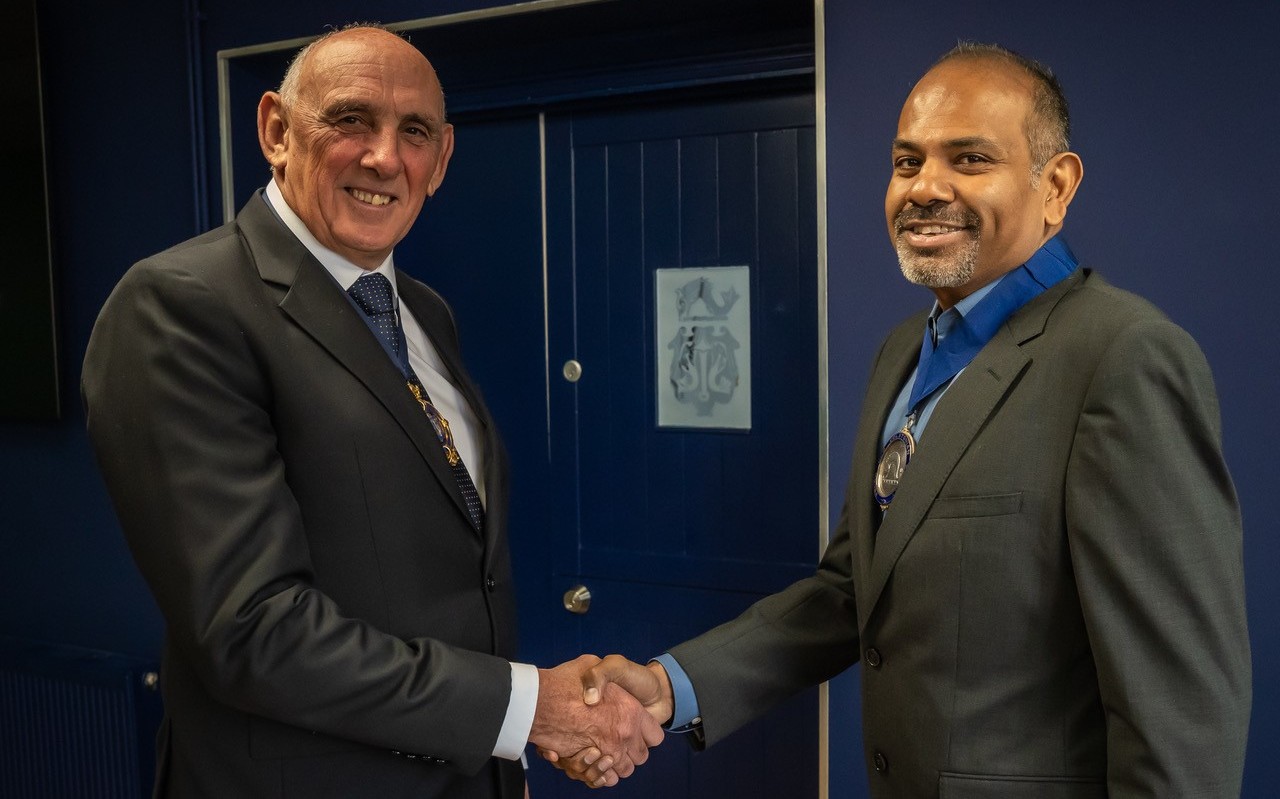 Len Collacott handing over to VIshal Balasingham